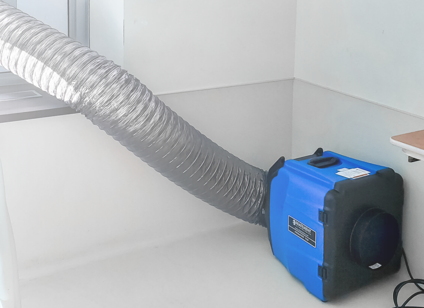 PRED750 Portable Air Scrubber attached to a duct hose