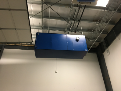 BSE AIRMAX CARBON Industrial Fume Extraction and Dust Collection Air Cleaner mounted on a ceiling, shown from a side angle with industrial surroundings.