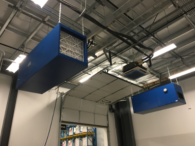 Different angle of the BSE AIRMAX Commercial Ambient Carbon Air Cleaner mounted on the ceiling with visible air filter.