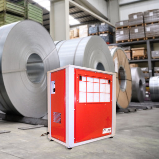 The EBac CD200 Industrial Dehumidifier is featured in an industrial setting with large metal coils in the background, illustrating the unit's application in heavy-duty environments, with a capacity of 138 PPD and 664 CFM, model number 10182GR-US