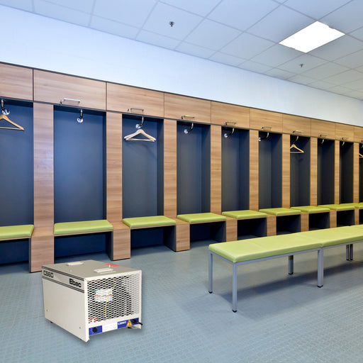 EBac CS60 Commercial Dehumidifier with 360 CFM placed in a locker room setting with benches and wooden lockers.