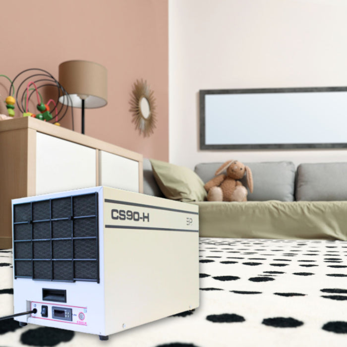 EBac CS90-H commercial and industrial dehumidifier with a capacity of 70 PPD and airflow of 360 CFM, displayed in a living room setting.