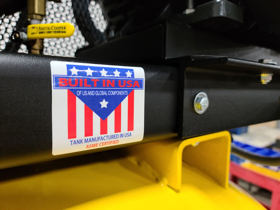 Close-up image showing a 'BUILT IN USA' label on the EMAX E350 Series 10 HP Air Compressor, highlighting the ASME certification and the statement of US and global components