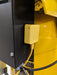 Close-up of the EMAX E550 Series 10 HP Air Compressor's silent air system, focusing on the connection point and hose.