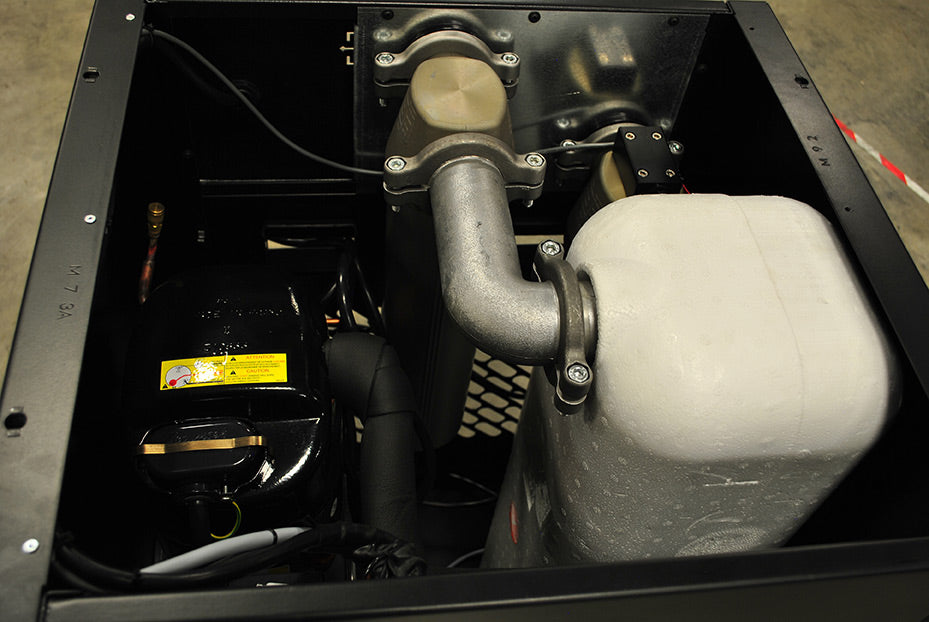 Inside view of the EMAX EDRCF1150115 air dryer, showing the compressor, refrigerant tank, and piping.