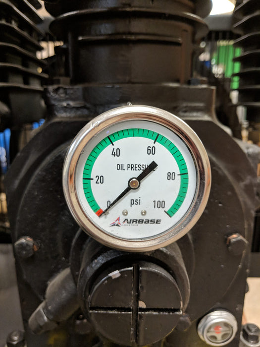 Close-up of the oil pressure gauge on the EMAX E450-GR 14hp gas driven air compressor