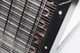 Side vent grille detail of an EBac industrial dehumidifier showing internal coil and airflow openings