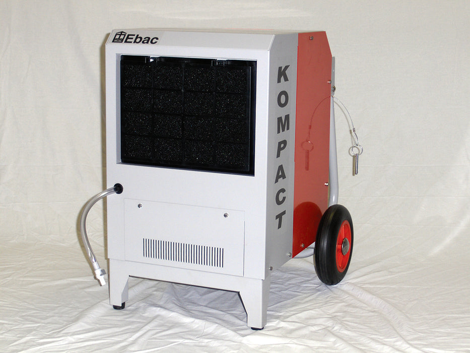 Front view of EBAC Kompact industrial dehumidifier showing air intake filter, compact cabinet, and drain hose