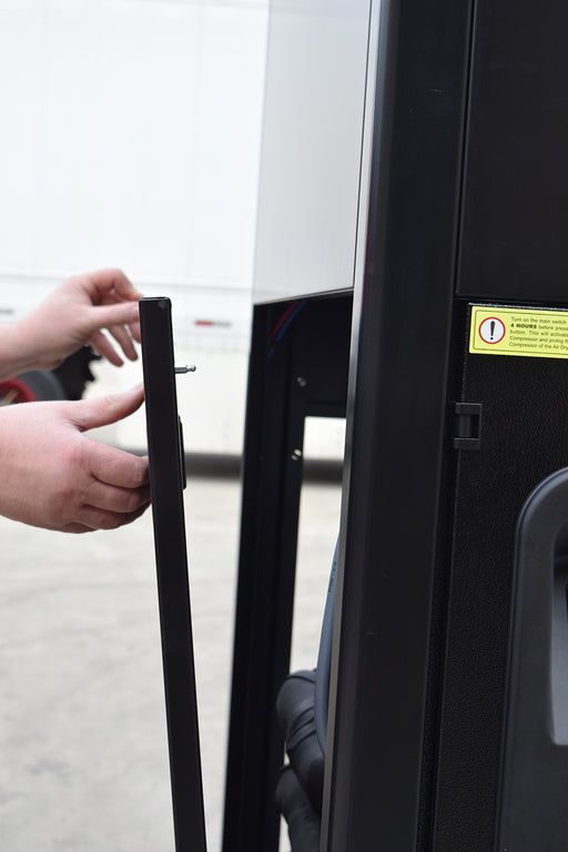 Technician opening access panel on EMAX 3 Phase Refrigerated Air Dryer with built in coalescing filter and auto drain for easy service access